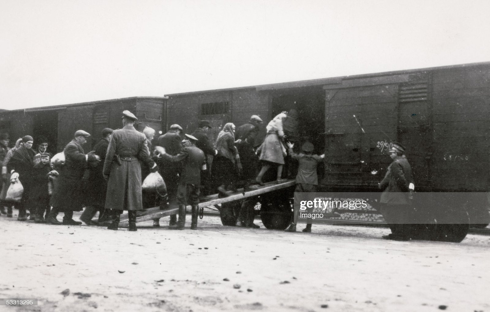 WARSAW, POLAND - CIRCA 1944: Holocaust: Deportation of Polish Jews in cattle carriages on "reloading point" in Warsaw. On the platform German soldiers. Photography. 1944. (Photo by Imagno/Getty Images) [Holocaust: Deportation von polnischen Juden per Viehwaggon auf dem "Umschlagplatz" in Warschau, auf dem Perron deutsche Soldaten. Polen. Photographie. 1944.]